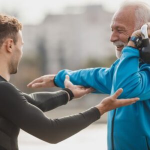 International fitness coach guiding athletes in a training session, representing the online Health, Fitness, and Coaching Bridge Program at Richmond Hill College to align international skills with Canadian standards.