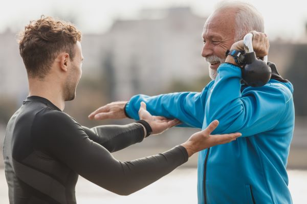 International fitness coach guiding athletes in a training session, representing the online Health, Fitness, and Coaching Bridge Program at Richmond Hill College to align international skills with Canadian standards.